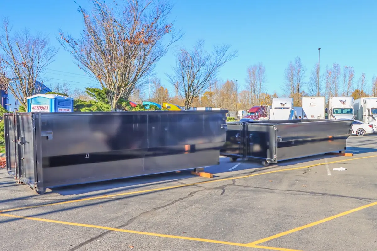 Professional dumpster rental service with roll-off container on residential driveway in Garfield Heights